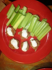 Buffalo chicken bites with blue cheese and celery sticks